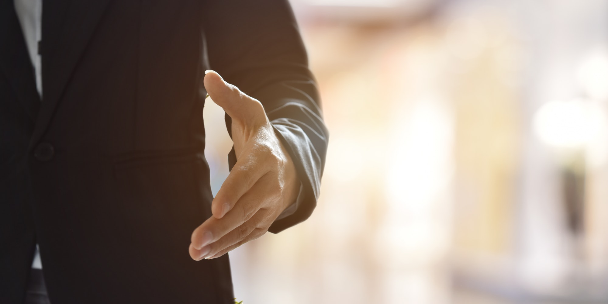 Businessman offering his hand for handshake